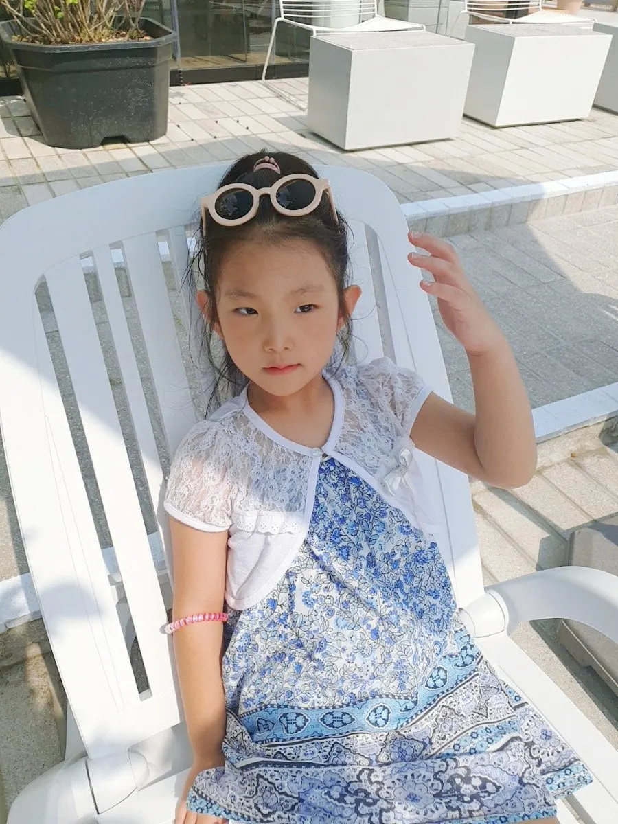 Child wearing children’s sunglasses image