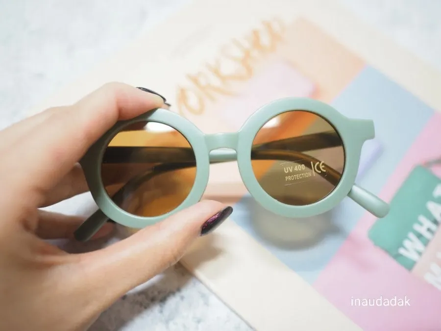 Kids’ sunglasses packed in an outing bag