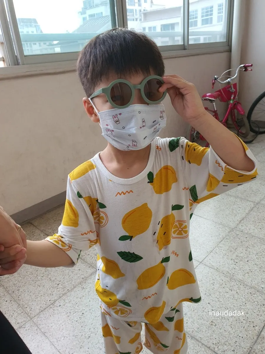 Playful child wearing sunglasses