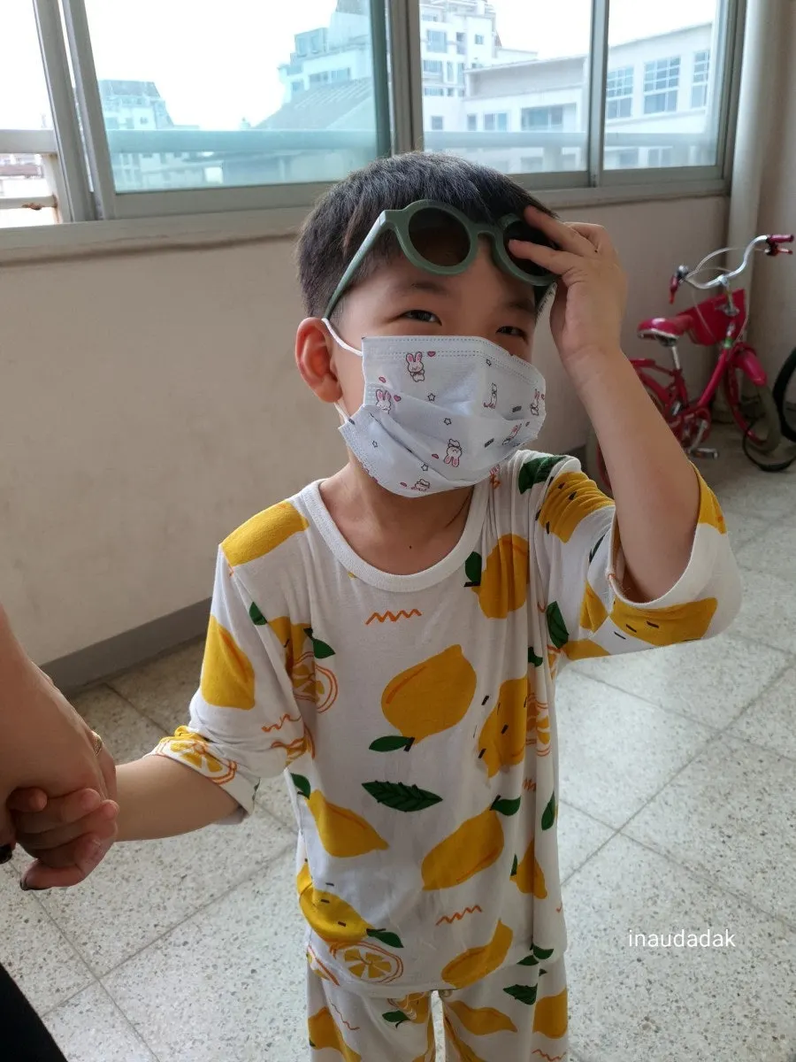 Child wearing kids’ sunglasses