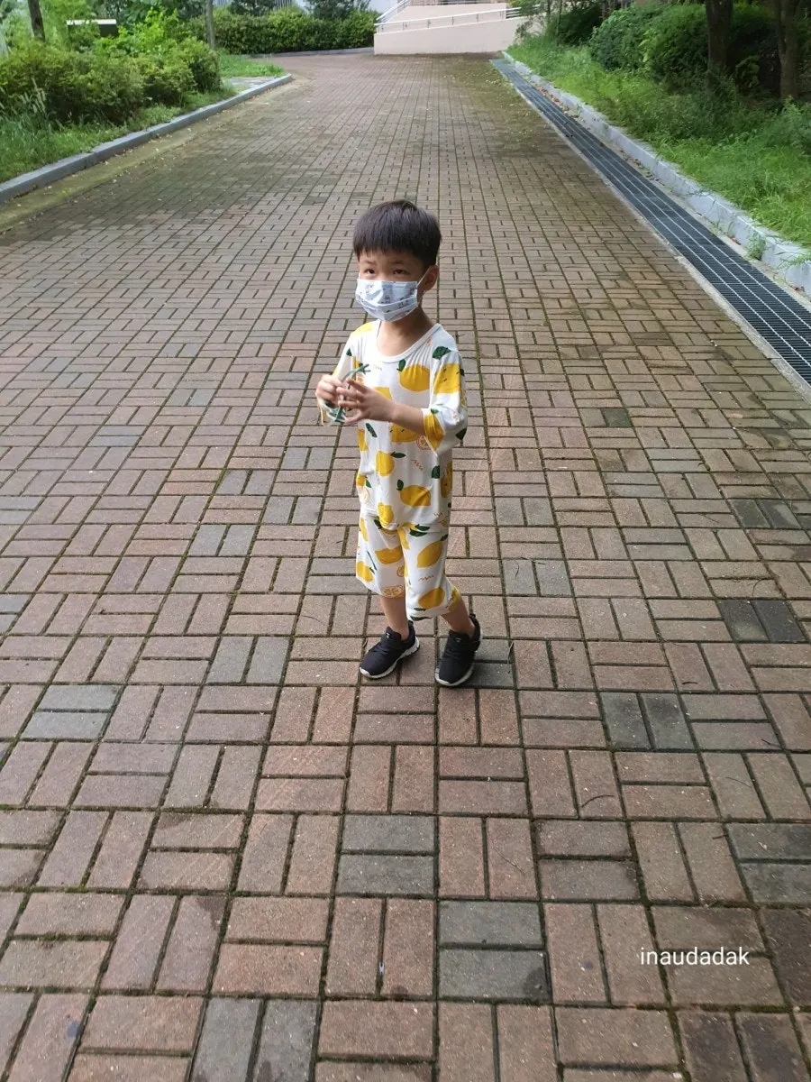 Child looking for sunglasses in the sunshine