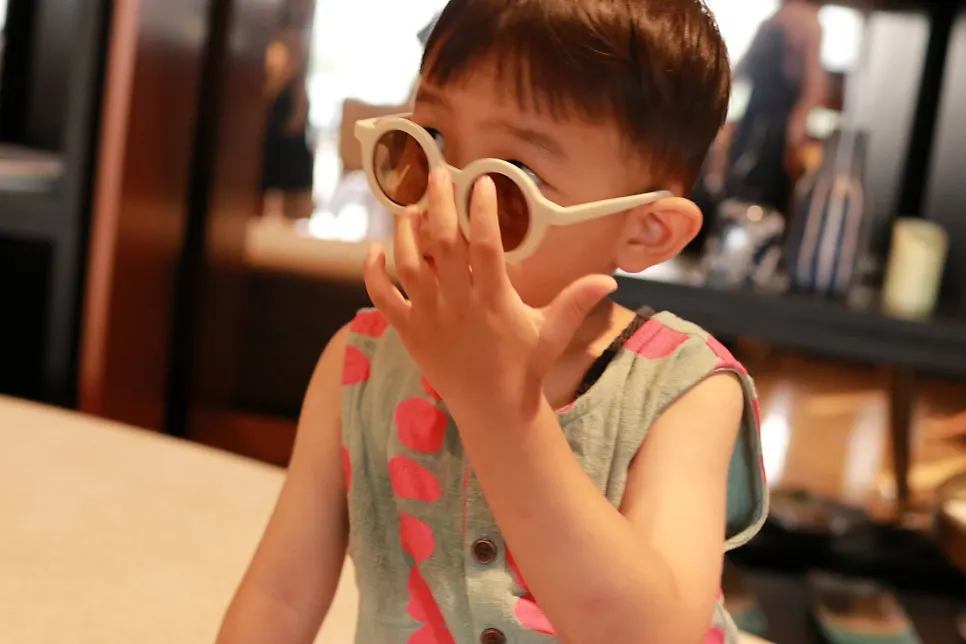 White sunglasses matched with a child's outfit