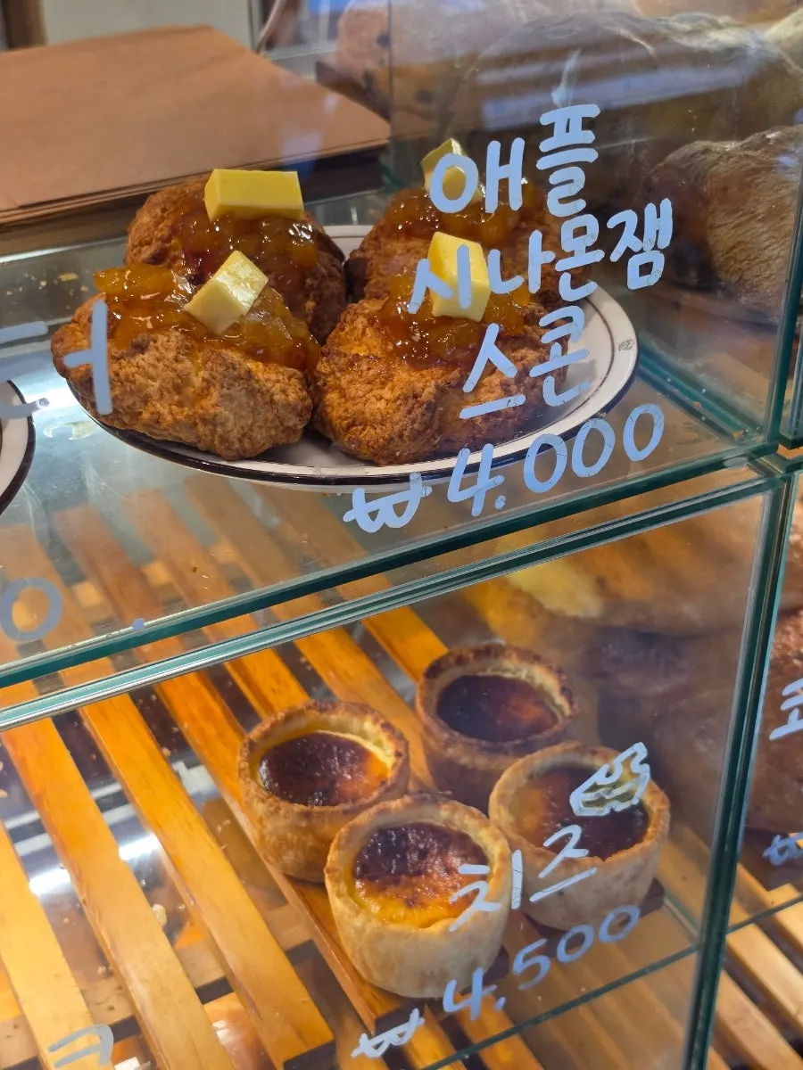 Egg tarts and baked cookies on display
