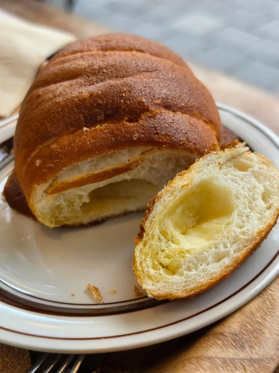 Garlic bread and cream bread on the counter