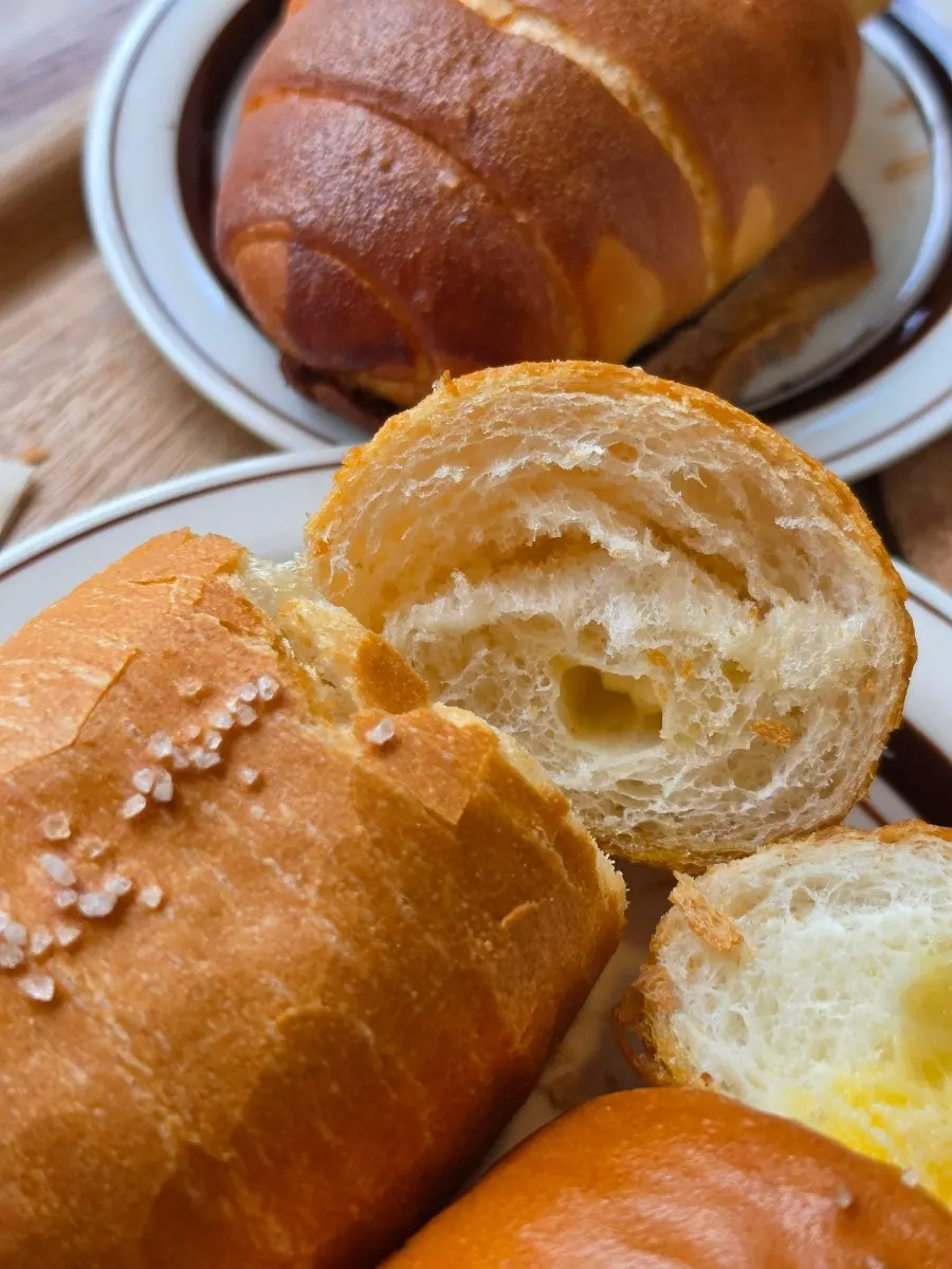 Takeout coffee and packed salt bread