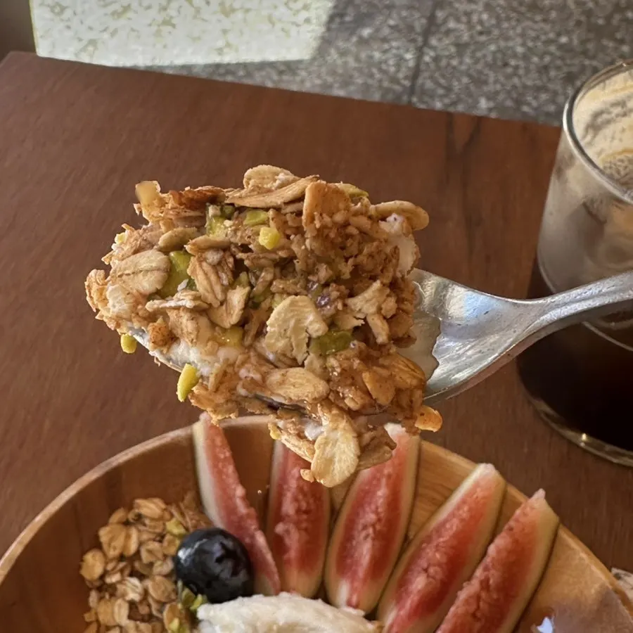 A bite topped with a large plump blueberry