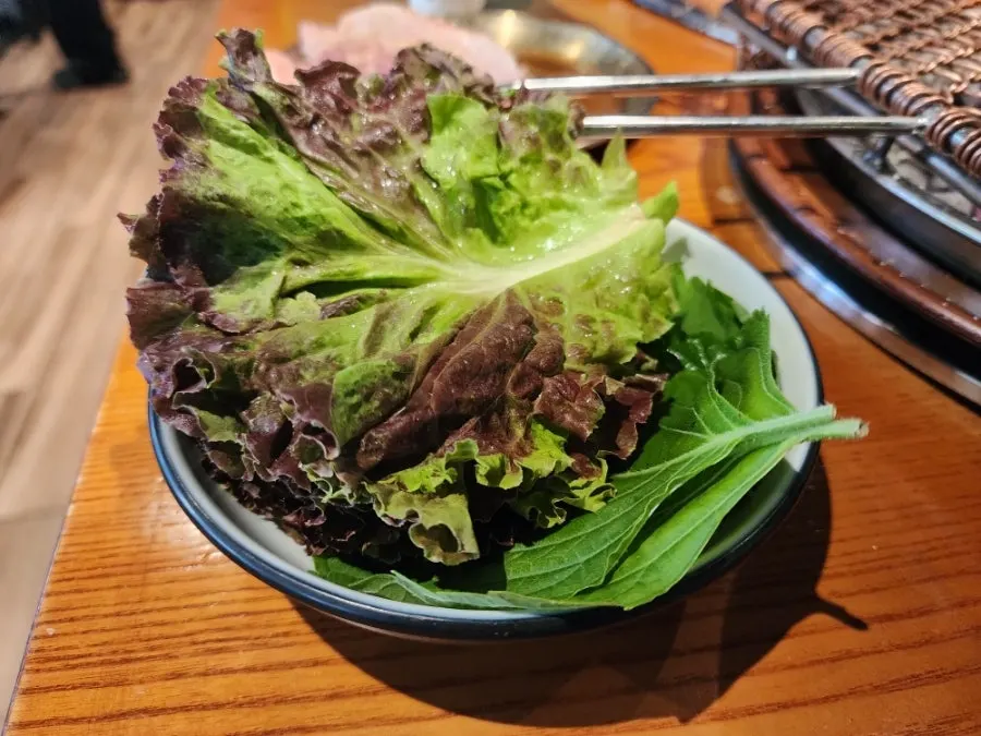 Picking up a piece of grilled beef short rib