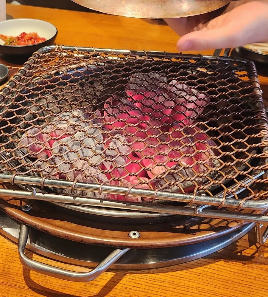 Coffee-tree charcoal brazier brought to the table