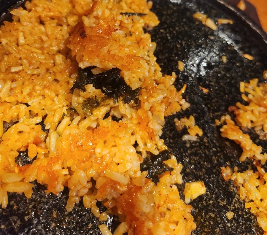 Crispy scorched rice at the bottom of the stone plate