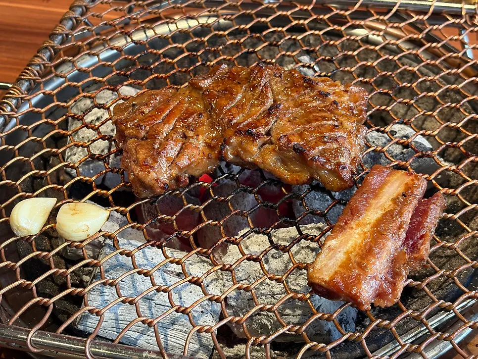 Ribs grilling over charcoal at Grill the Terrace Dongtan Main Branch