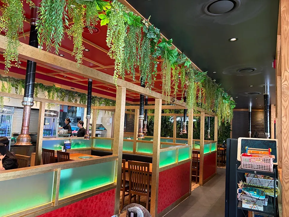 Interior of Grill the Terrace decorated with green plants