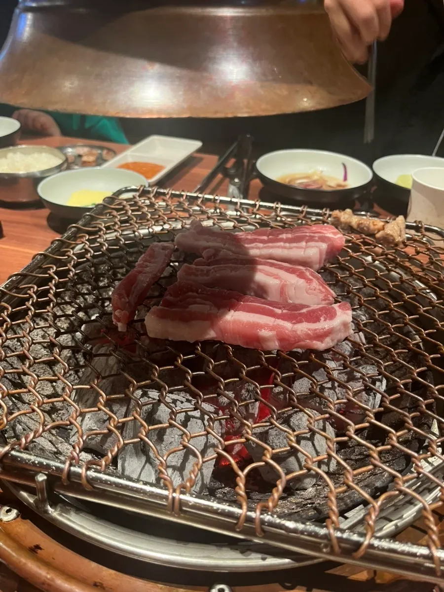 A plate of meat served with lettuce wraps