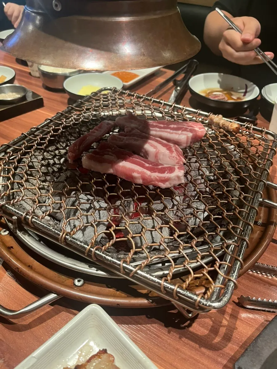 A piece of meat on the table during the couple's dinner