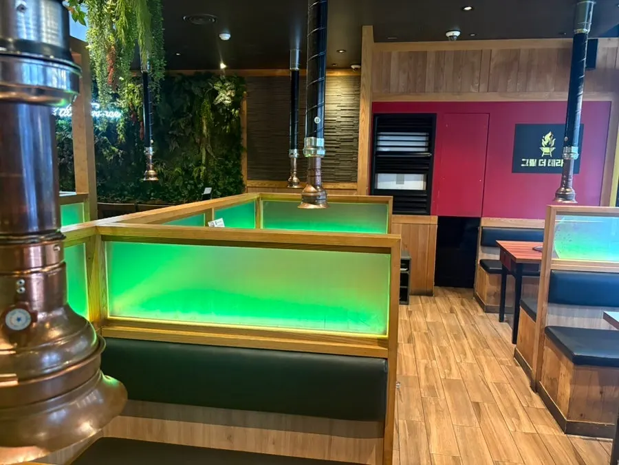 Plant-decorated interior dining hall of Grill the Terrace