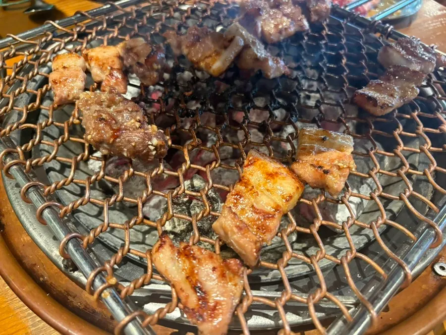 Garlic-marinated meat just starting to grill