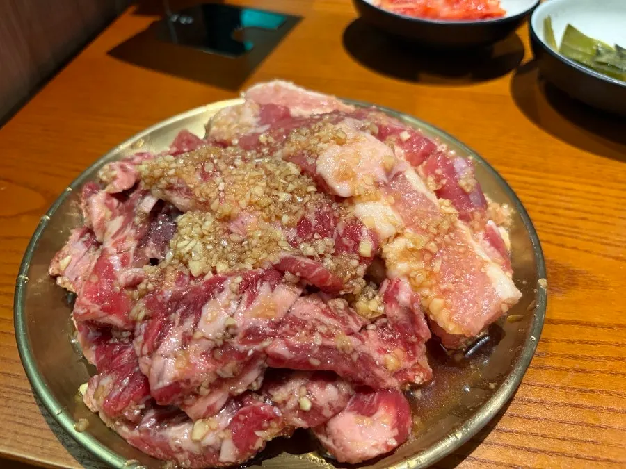 Uiseong garlic-marinated beef short rib and pork belly before grilling