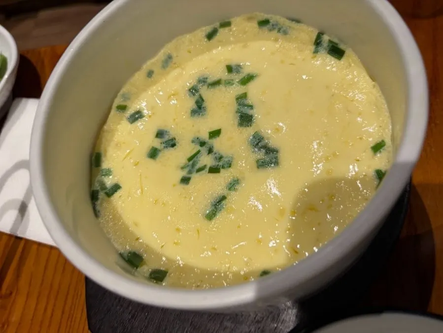Steamed egg served in an earthenware bowl