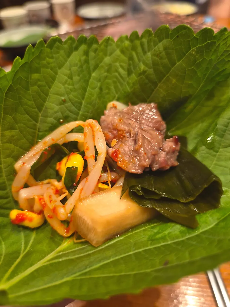 A grilled piece of beef served with onion