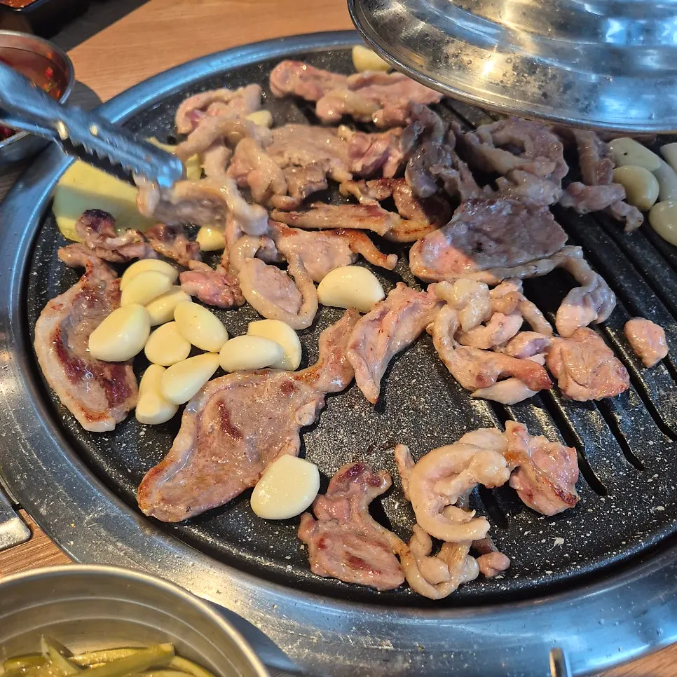 Marinated duck jumulleok on a gas burner
