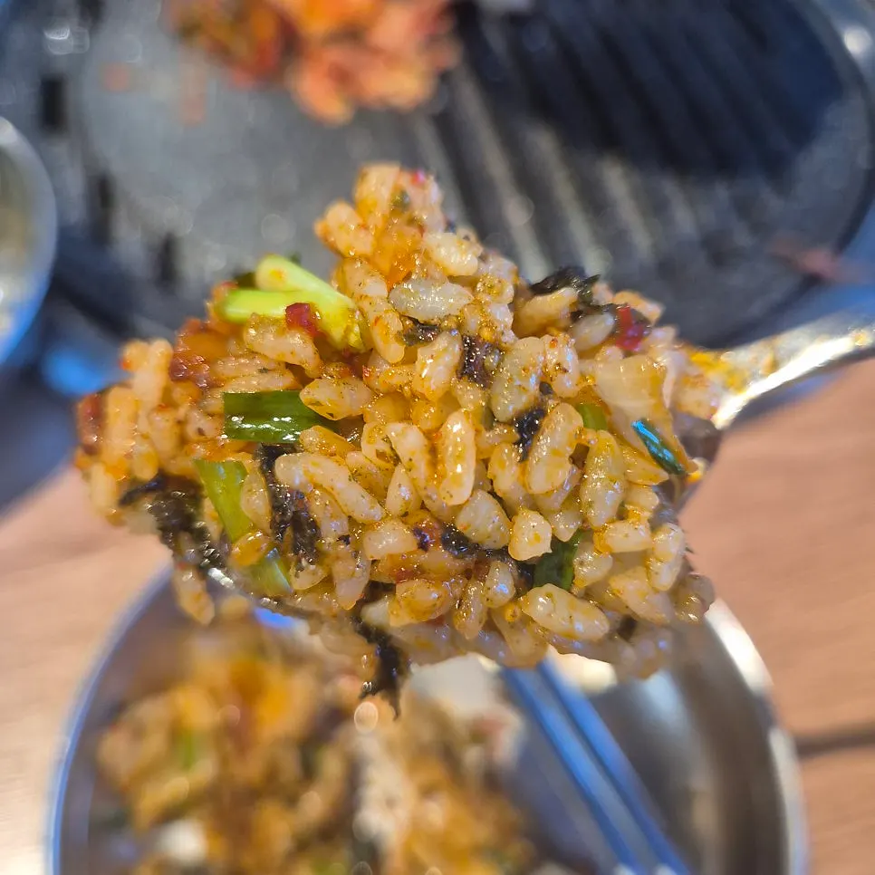Chive fried rice being stir-fried on the grill