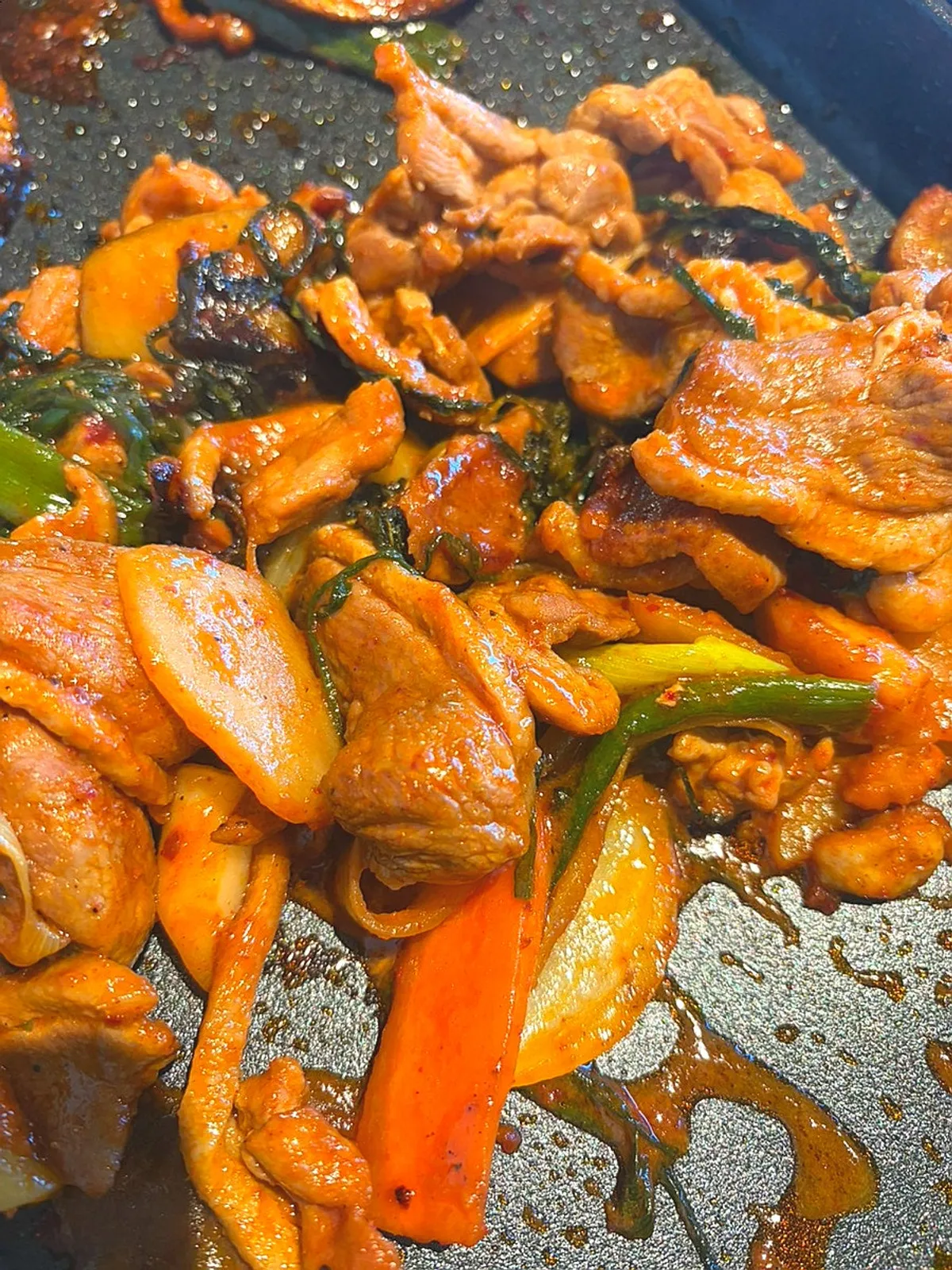 Generous marinated duck cooking on the grill