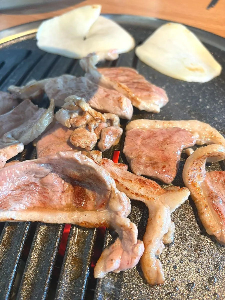 Fresh duck and accompaniments on the grill