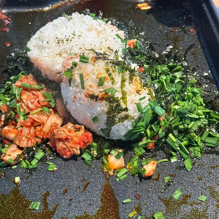 Marinated duck fried rice being cooked