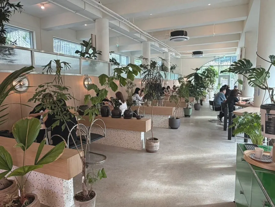Seating with wood-tone interior at Geurimseu Cafe