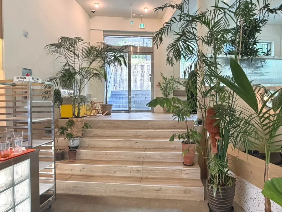 Indoor corner of Geurimseu Cafe decorated with small props