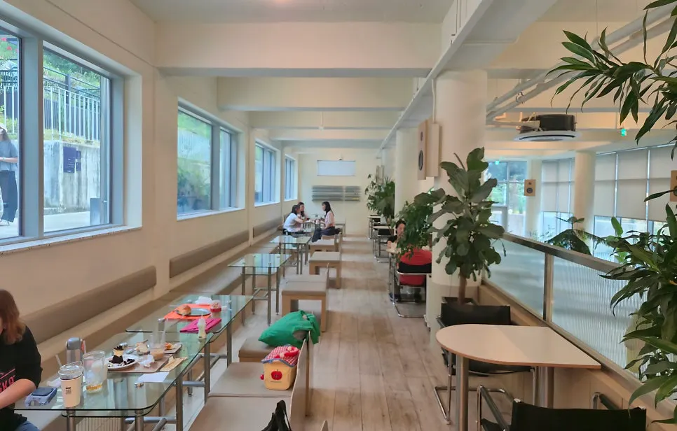 Indoor split mid-level table seating at Geurimseu Cafe