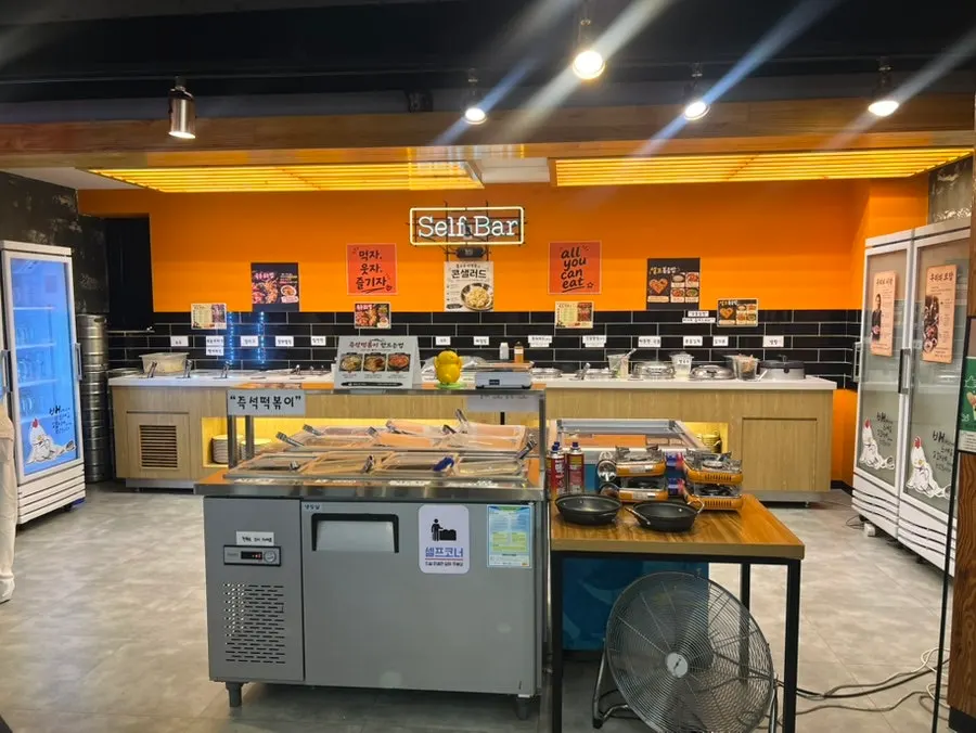 Self-serve bar corner with meat and vegetables