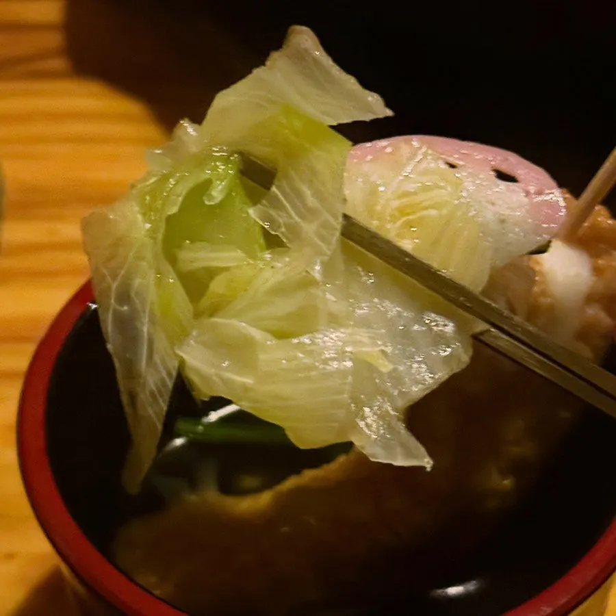 Fish cake and vegetables dipped in soy sauce