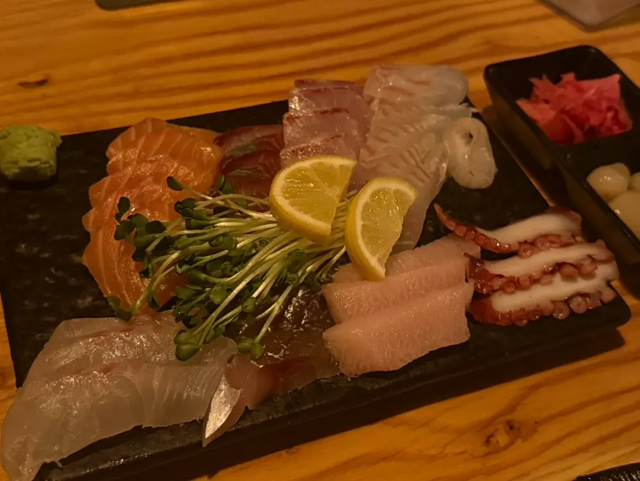 Sashimi small plate with flounder, salmon, and yellowtail