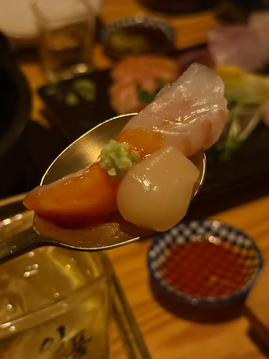 Sashimi served with pickled radish, wasabi, and radish sprouts