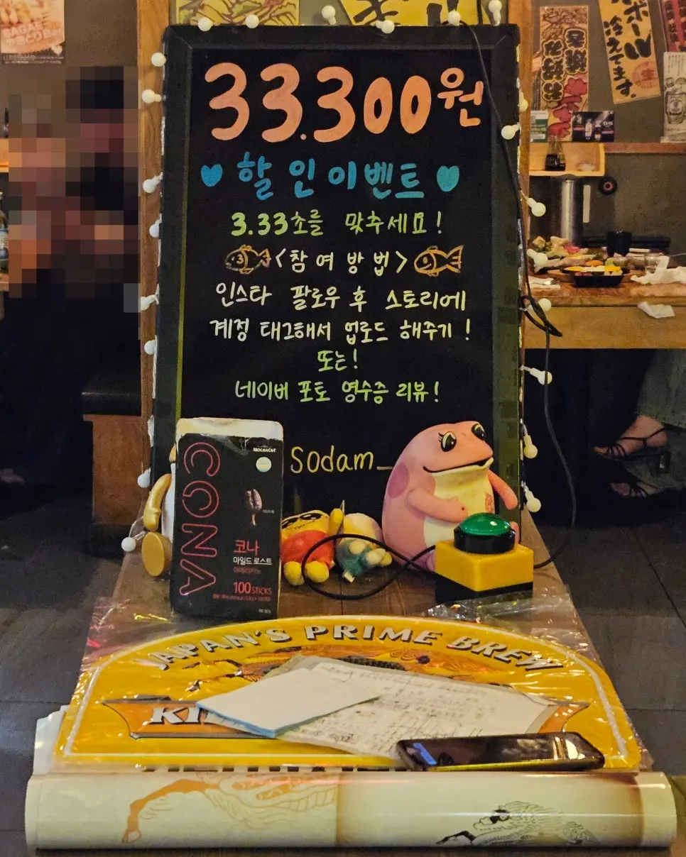 Discount event chalkboard set up in the middle of the hall