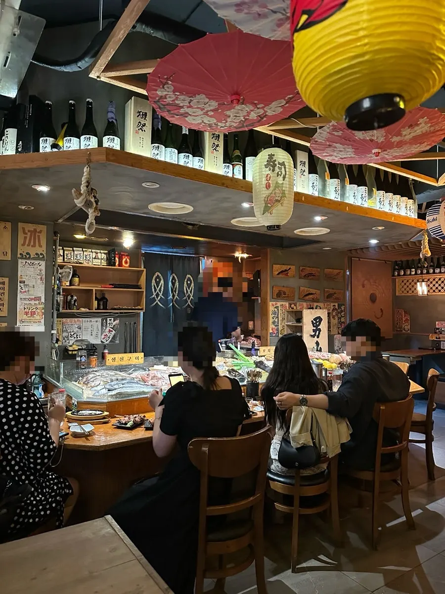 Spacious izakaya hall seating extending deep into the back