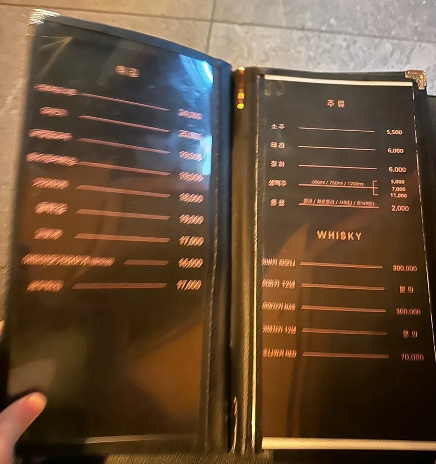 Menu board listing drinks and specialty dishes
