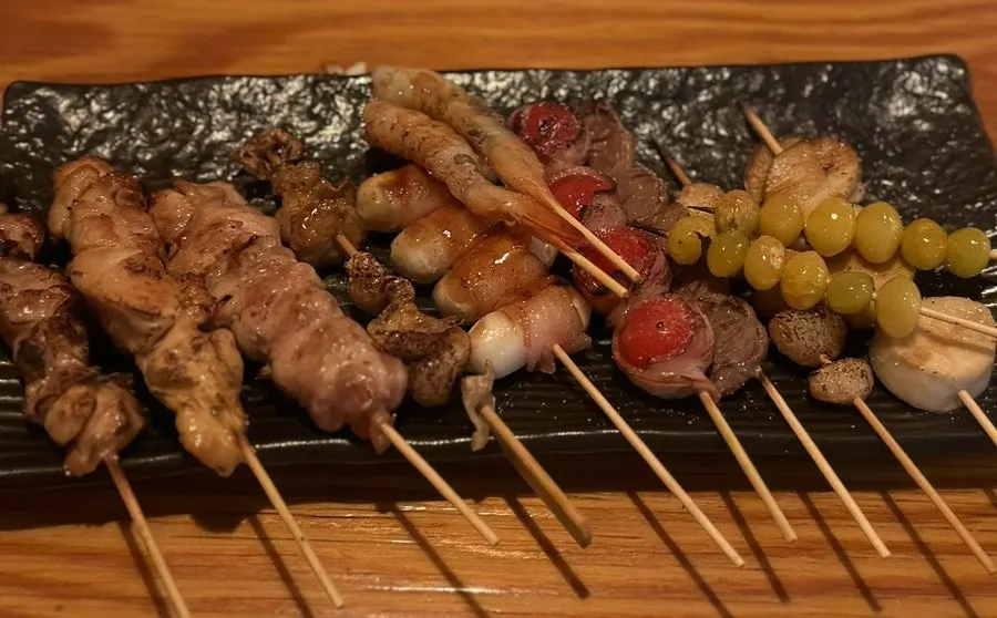 A plate of assorted mixed skewers