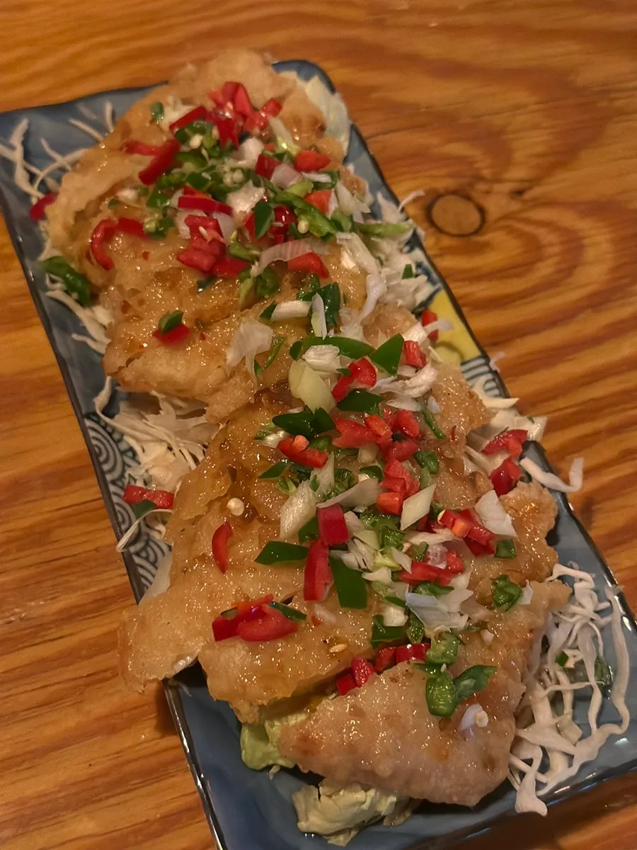A plate of yurinki served over cabbage