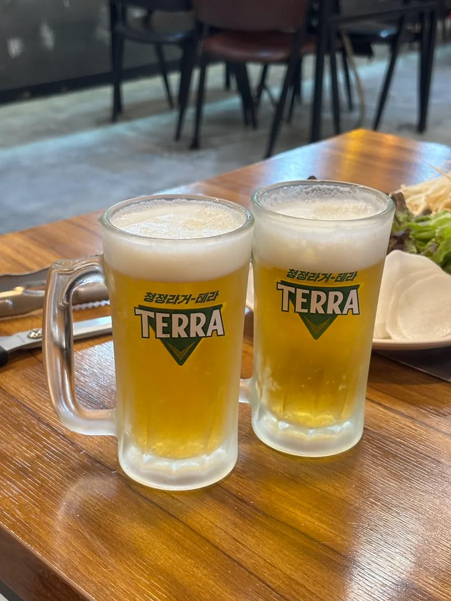 A self-poured glass of draft beer