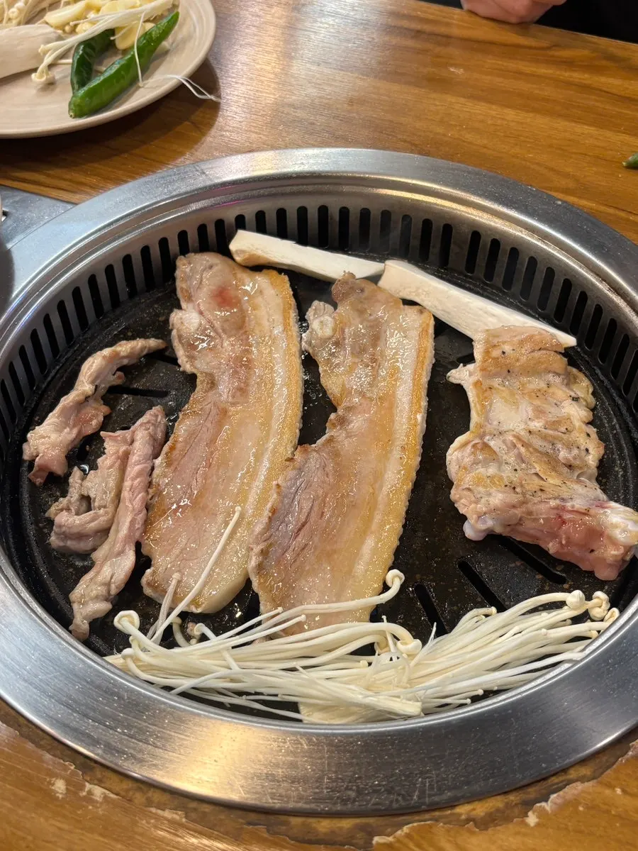 Pork belly grilling on the pan