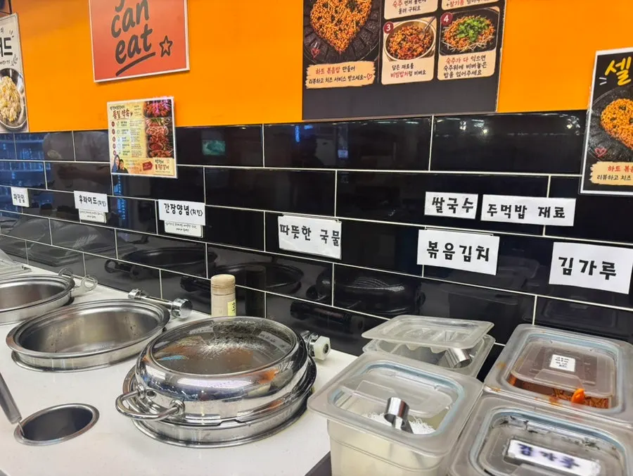 Stir-fried kimchi, rice, and seaweed flakes at the self-bar