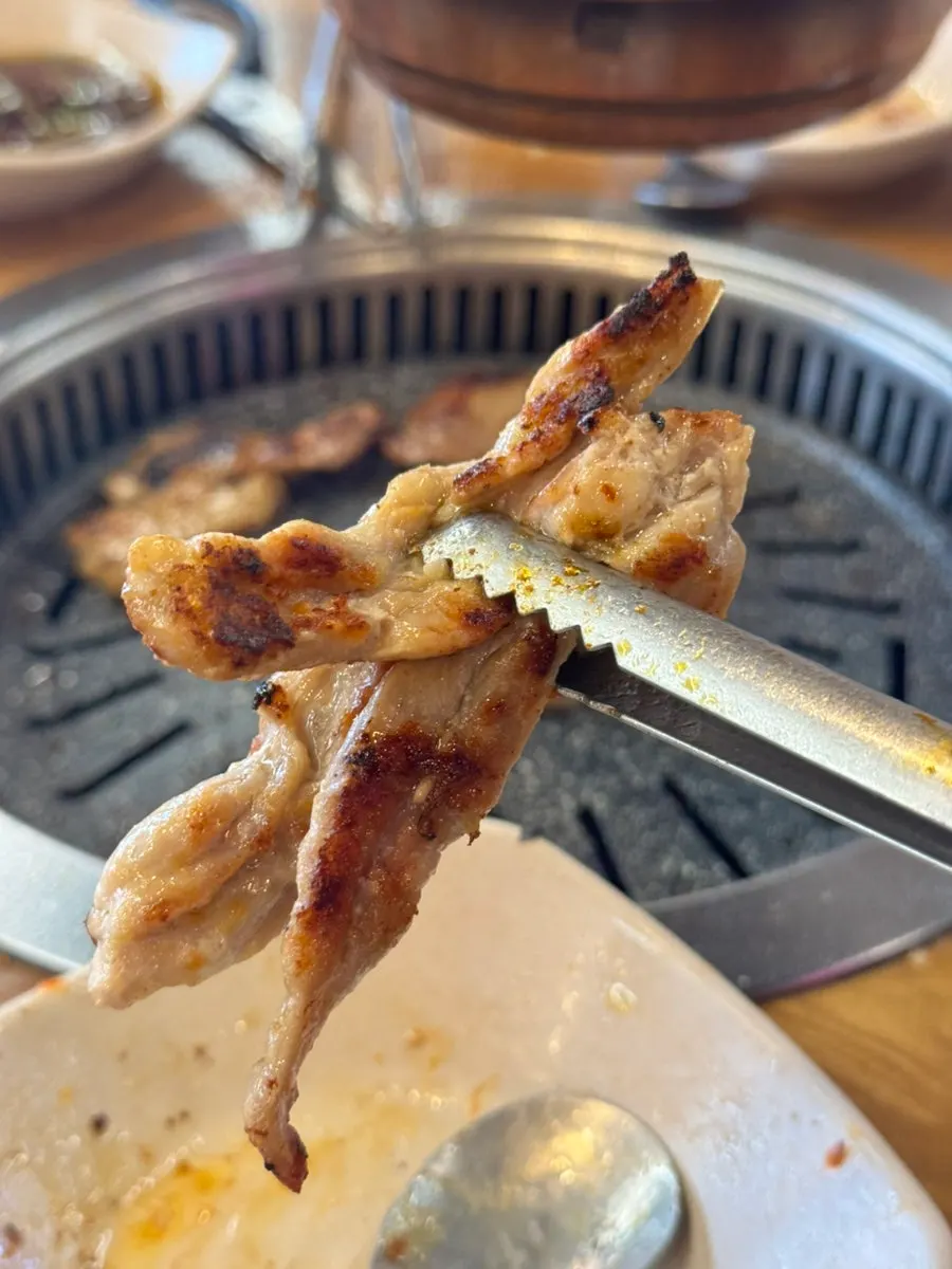 Close-up of golden-brown grilled chicken neck