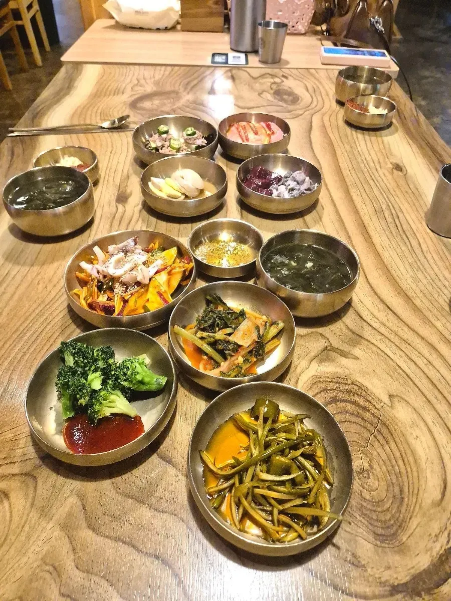 Generous basic spread with seasoned raw fish salad and pickles