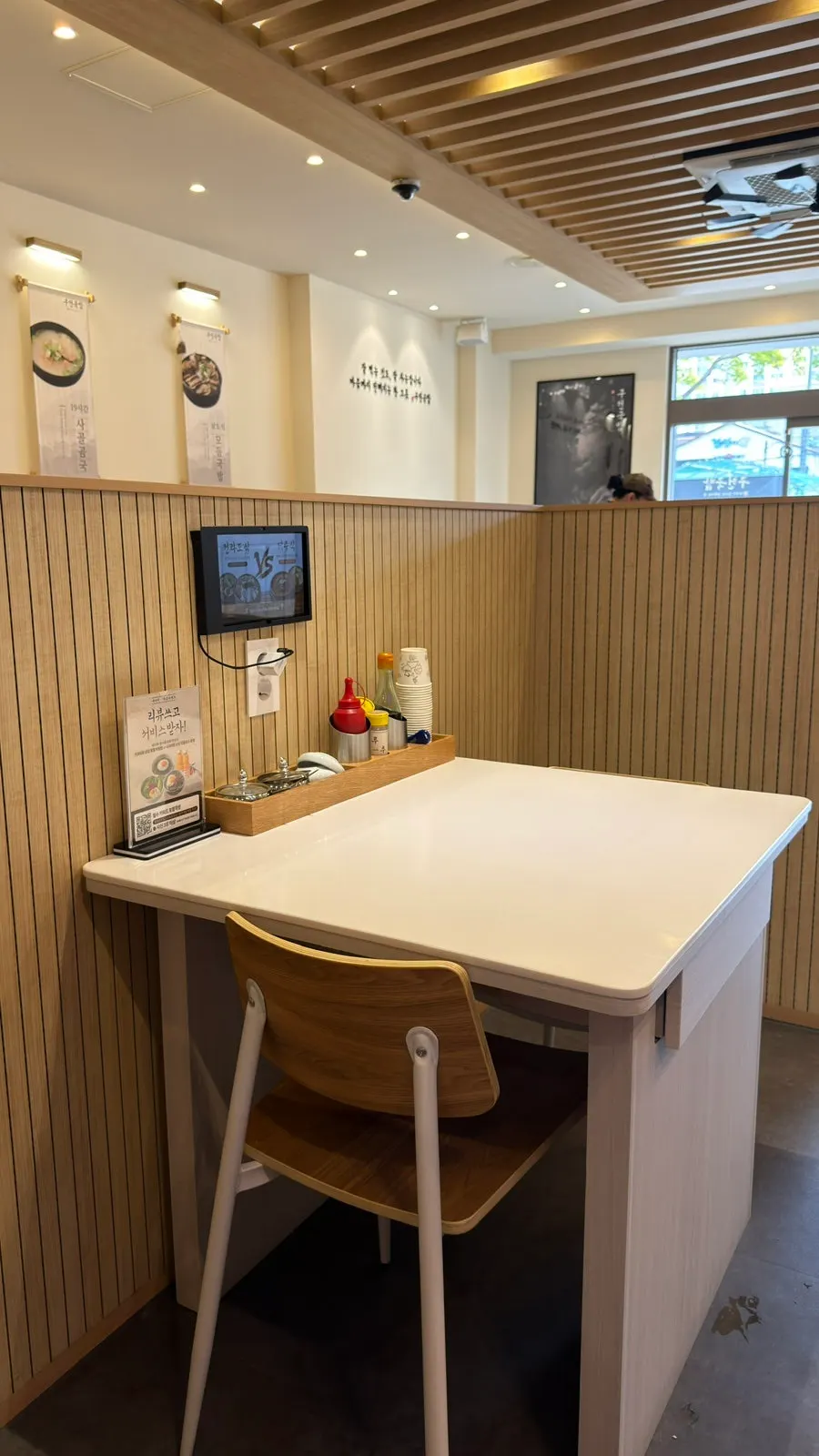 Bright wood-toned interior of Gujeon Gukbap