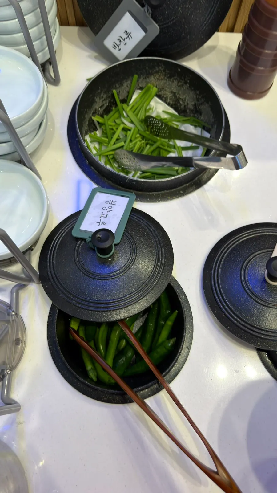 Self-serve bar side dishes with cheongyang chili peppers and dadaegi