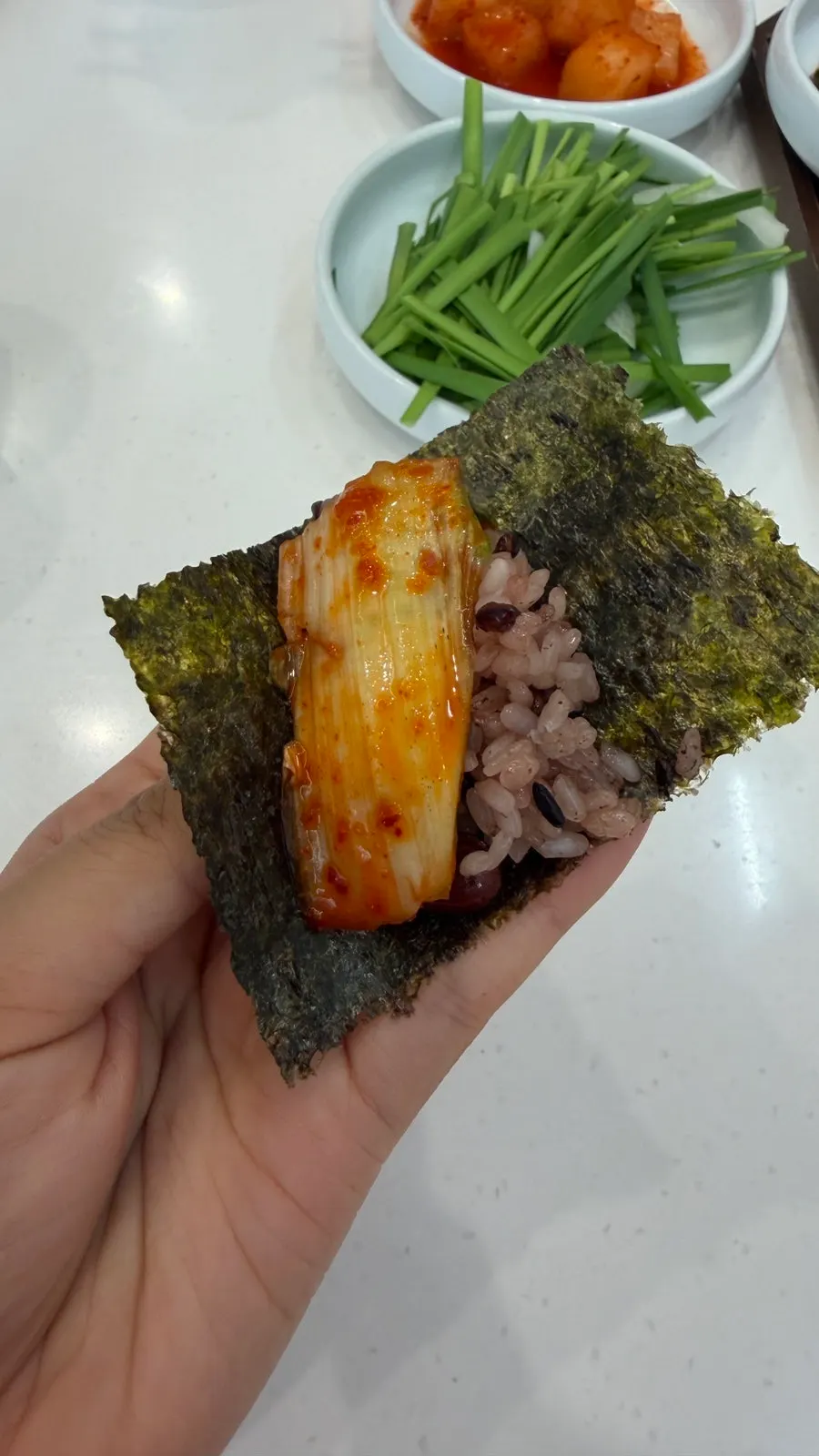 Chapssal served with seaweed, salted shrimp, and halmaeng kimchi
