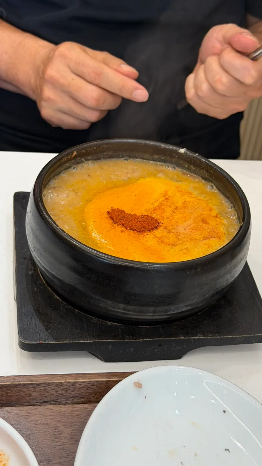 Jeju-style bracken gukbap simmered in a stone pot