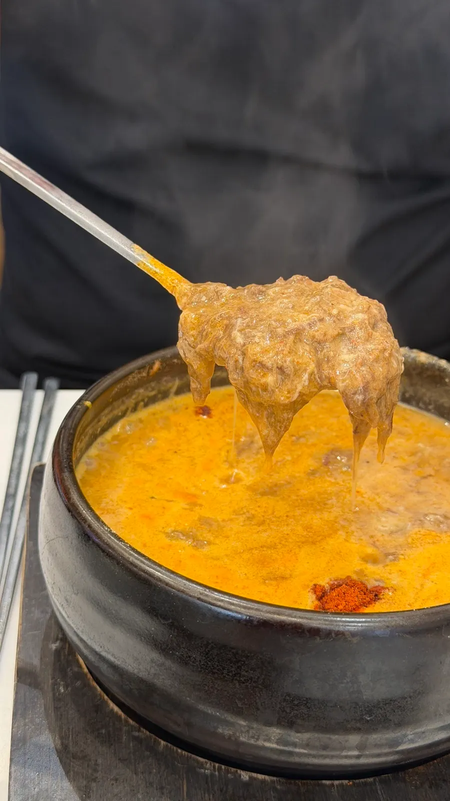 A spoonful of thick bracken gukbap broth