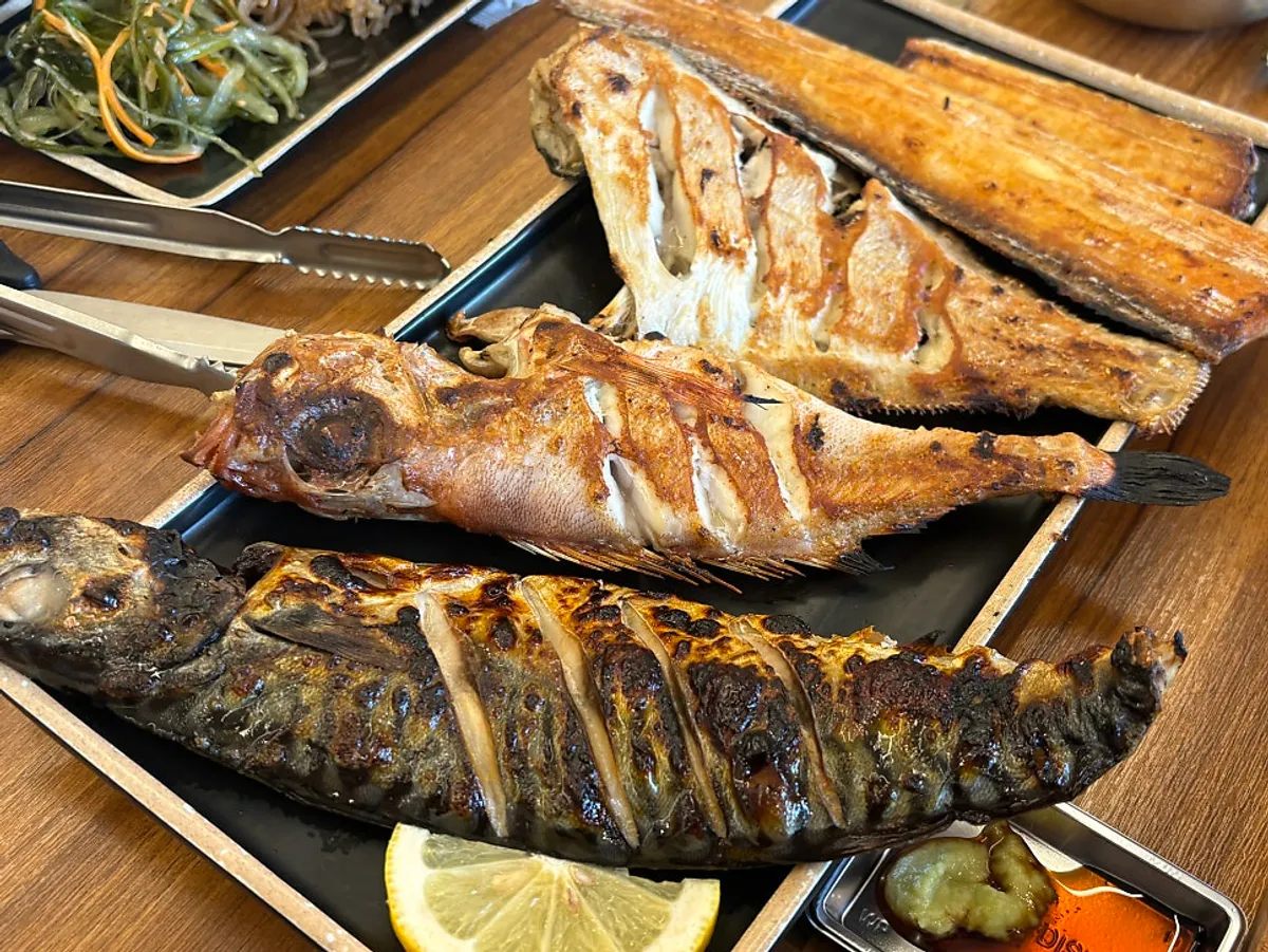 Fire-grilled fish table spread at Guigo in Yongin